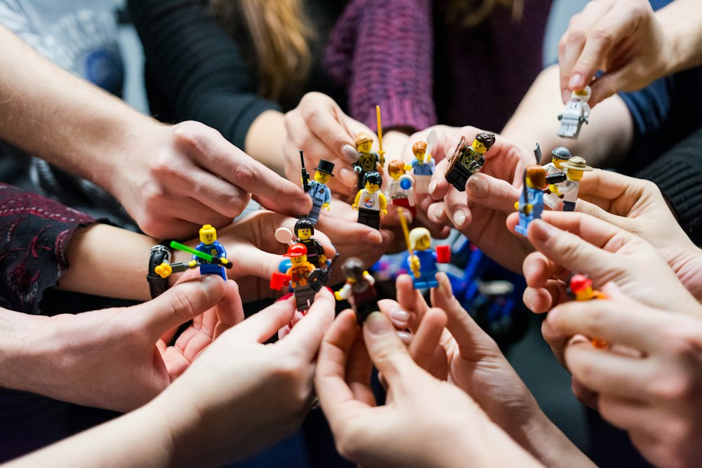 Children's hands playing with toy figures