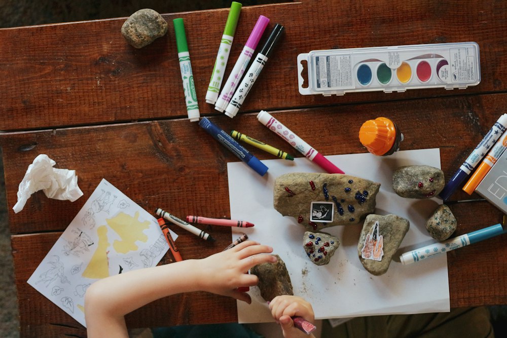 Children's art supplies on a wooden table